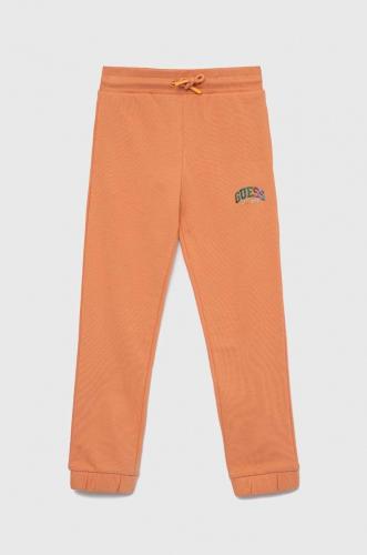 Guess pantaloni de trening din bumbac pentru copii culoarea portocaliu, neted